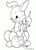 Easter bunny decorating Easter egg